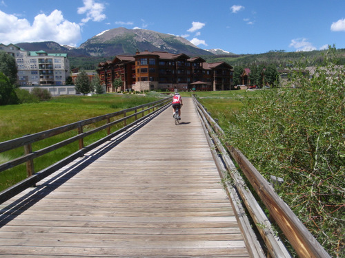 Long wood trail bridge, over the wet land, leads to the town of Frisco.